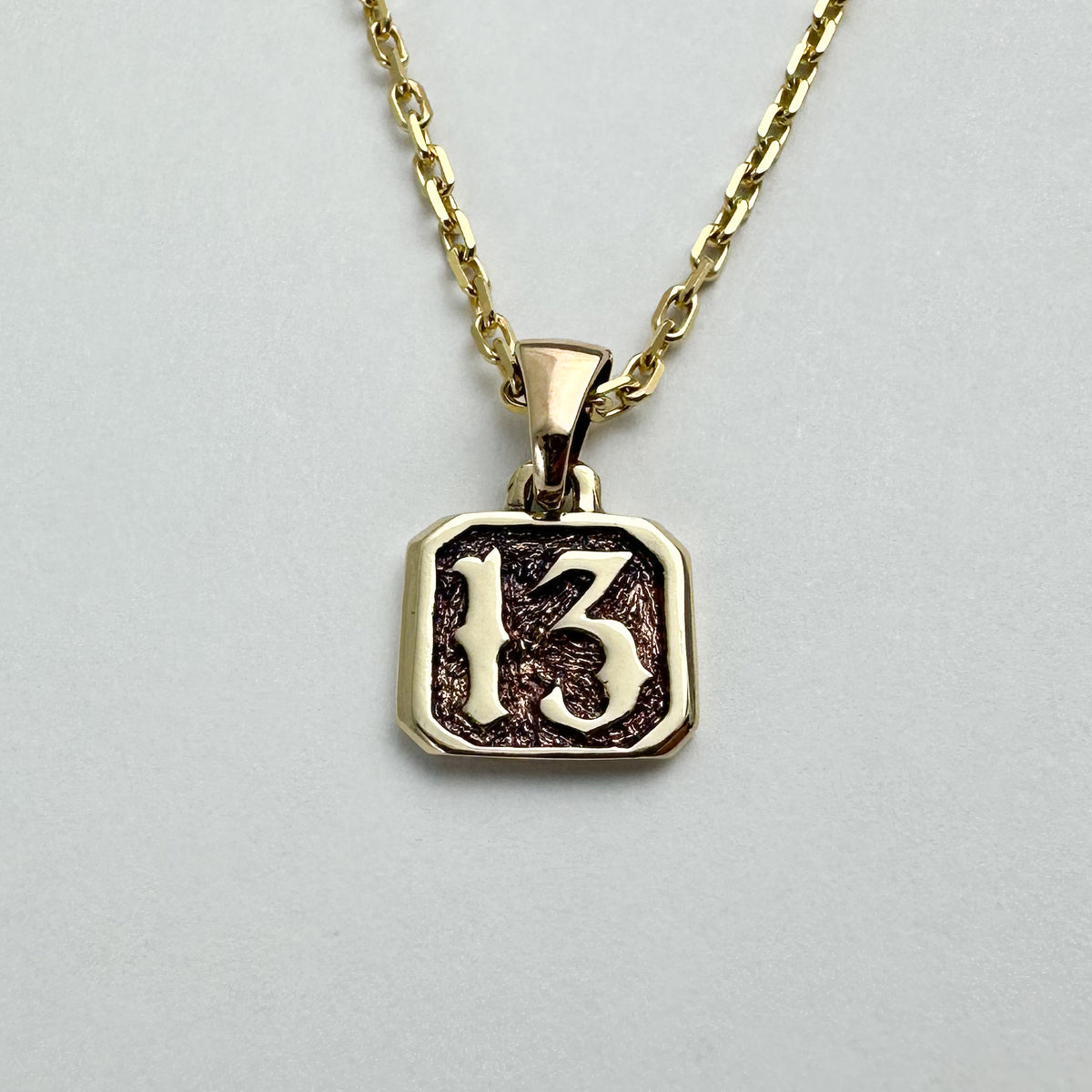 13 Pendant - Solid 9ct. Gold