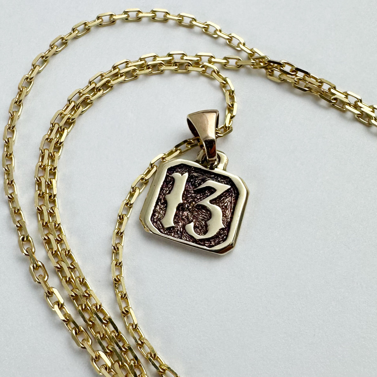 13 Pendant - Solid 9ct. Gold